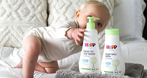 Baby grabbing HiPP bath products