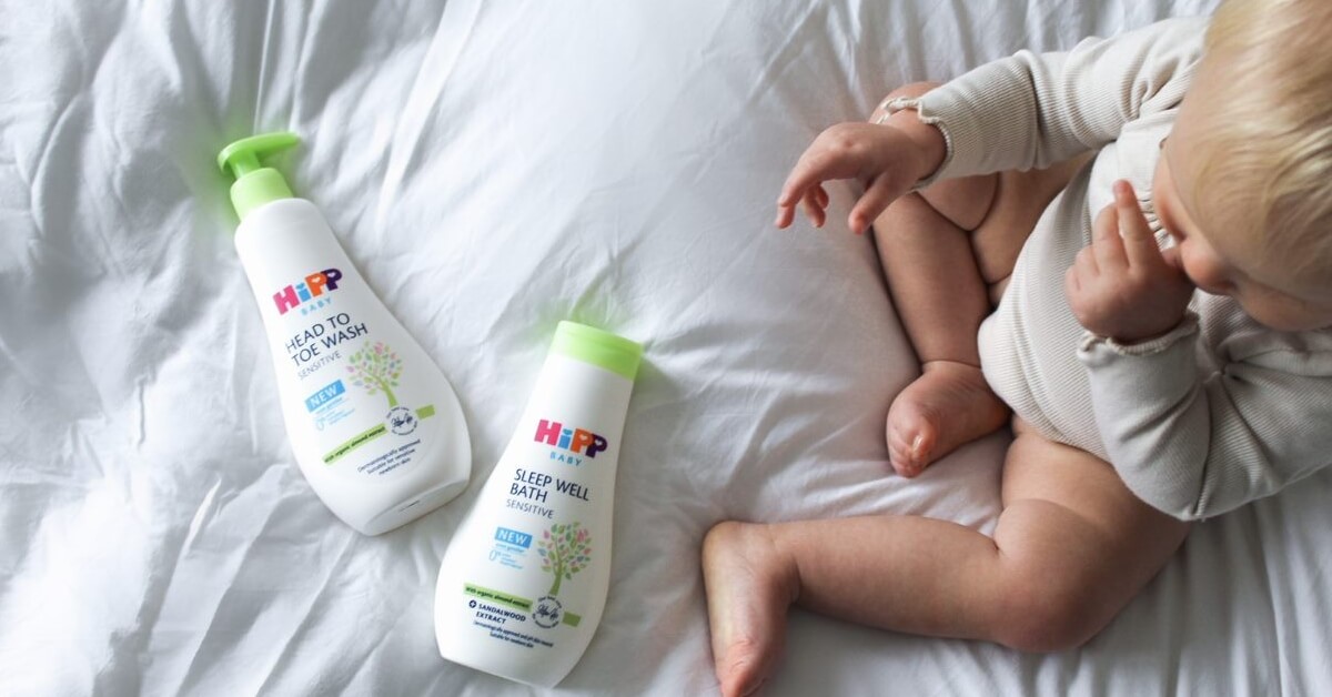 Baby set on bed with HiPP products