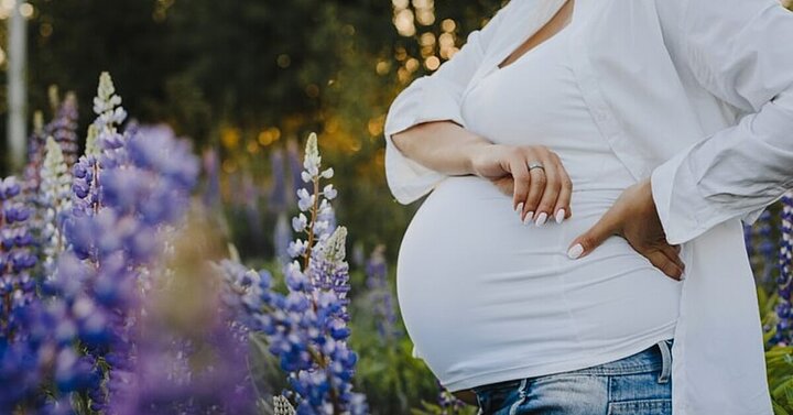 Pregnant woman in field