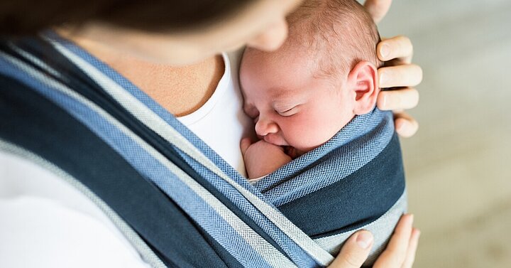 Mum with newborn baby in sling