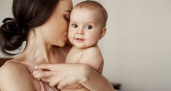 Mum holding baby close