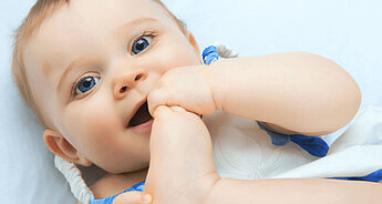 Baby playing with her foot