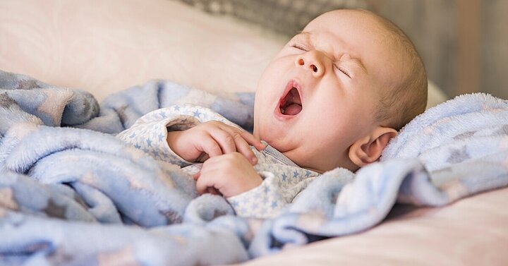 A baby yawning