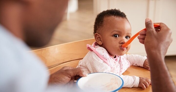 Baby being spoon-fed