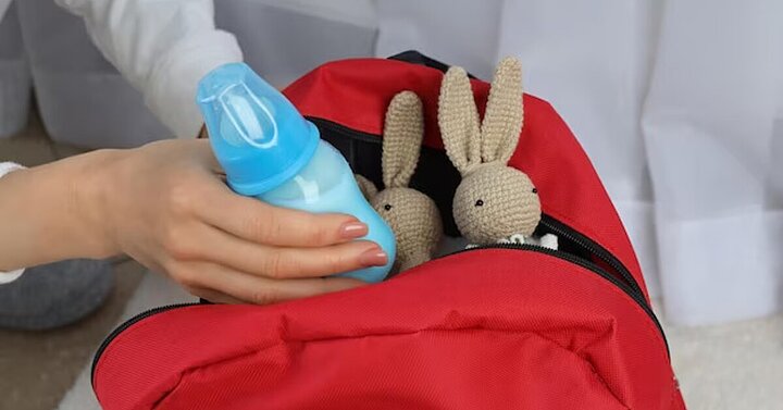 Baby bottle being packed in bag