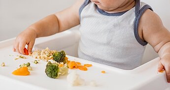 Baby trying different vegetables 