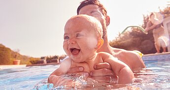 Dad and baby in swimming pool