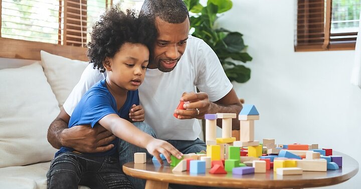 Dad and son playing with building blocks