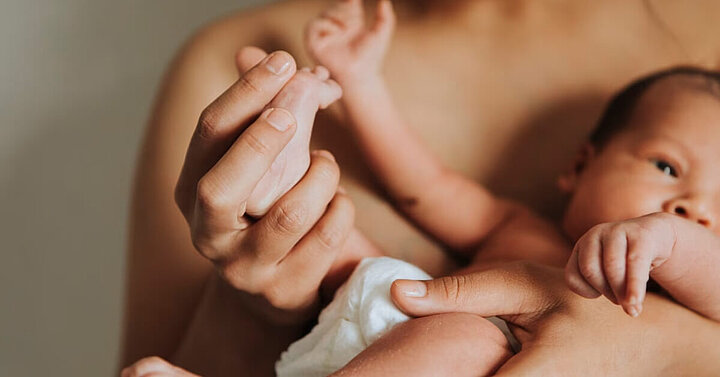 mum holding a newborn baby