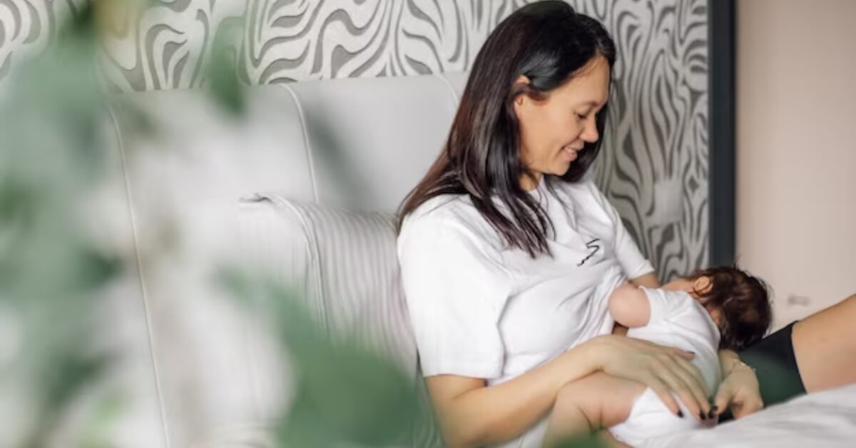 Mum breastfeeding baby in bed