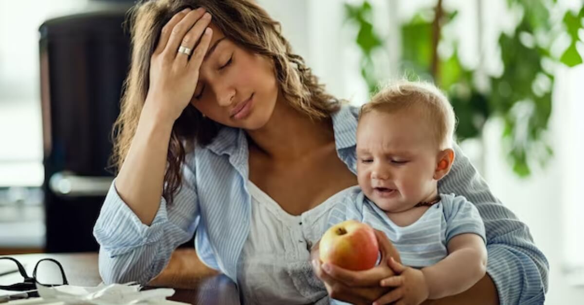 Stressed out mum with baby on lap