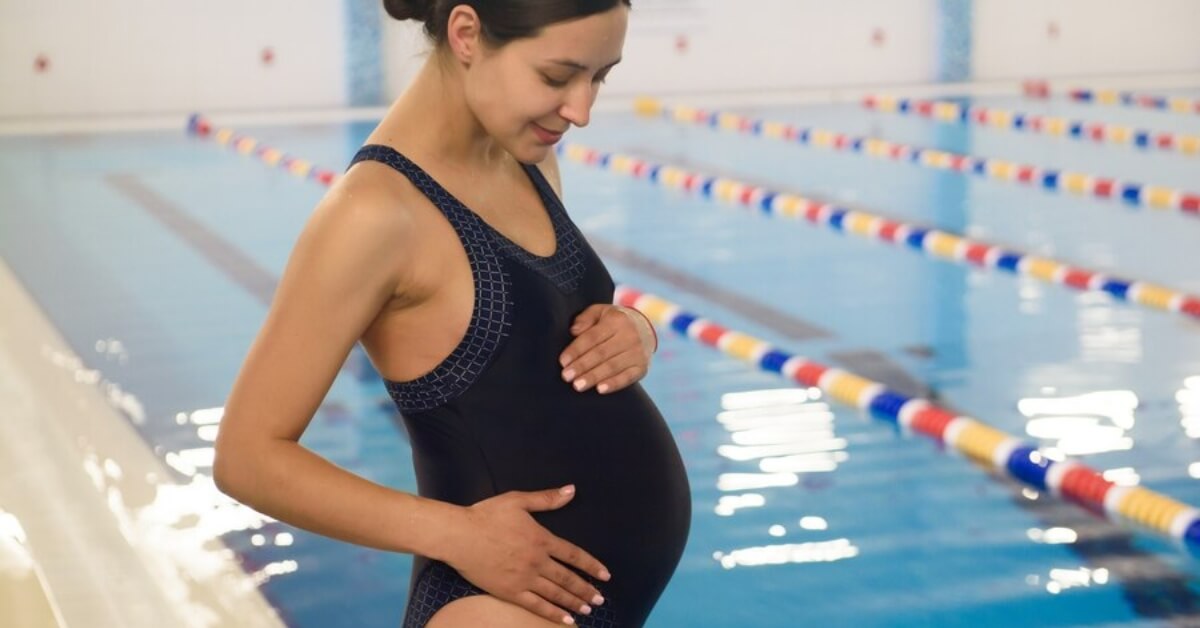 Pregnant woman preparing to go swimming