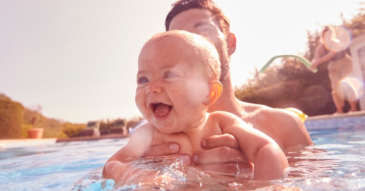Dad and baby in swimming pool