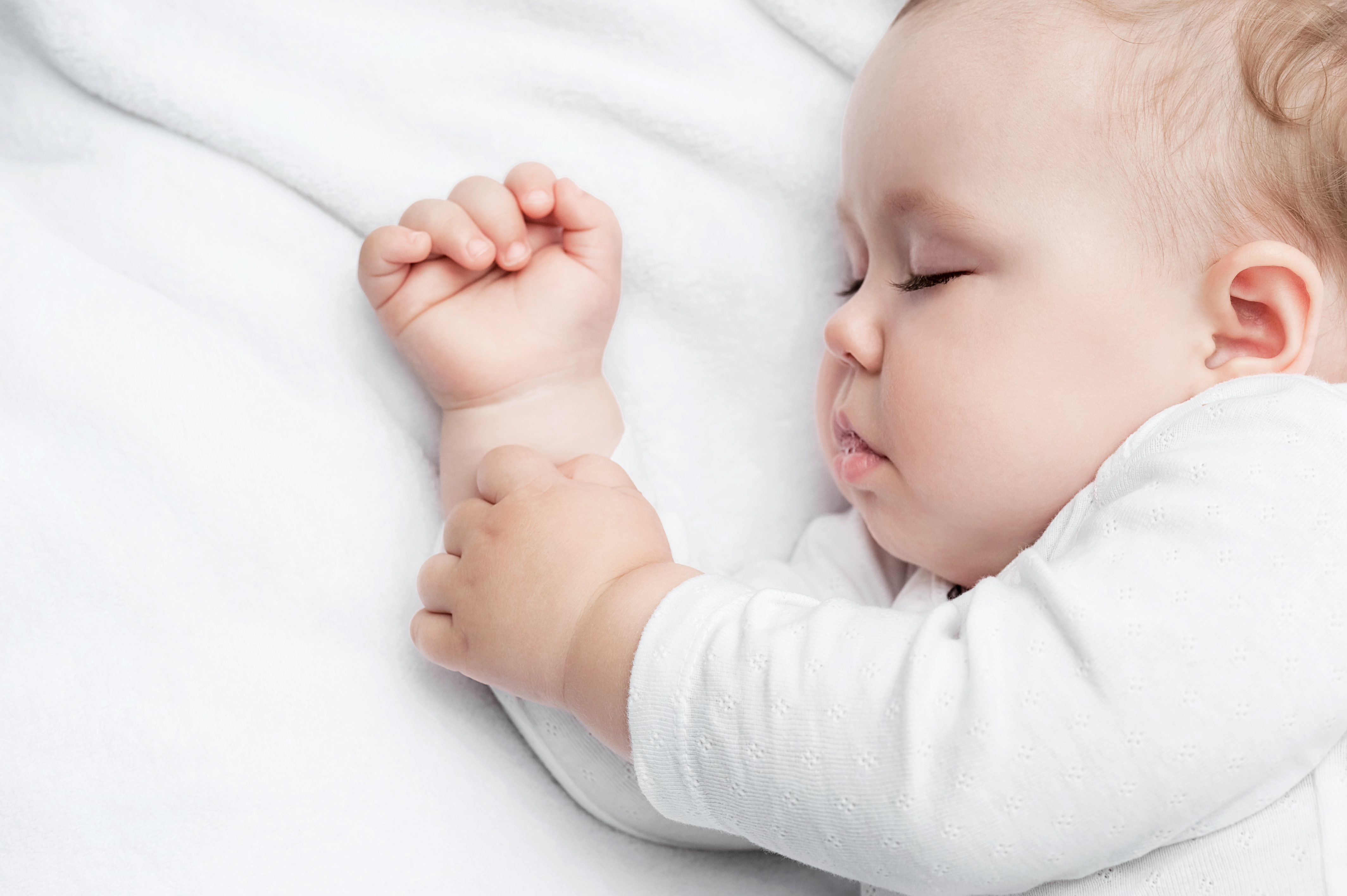 Baby sleeping in cot